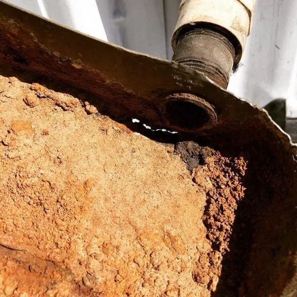 how much water should be in AC drip pan